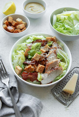 A bowl  of  Caesar salad