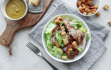 A bowl  of  Caesar salad