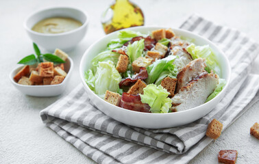 A bowl  of  Caesar salad