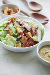 A bowl  of  Caesar salad