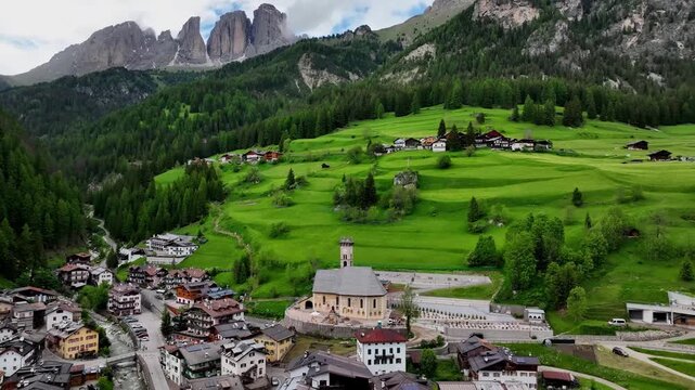 Aerial view above Val di Tires, with the Catinaccio - Torri del Vajolet Rosengarten in the background, South Tyrol, Italy