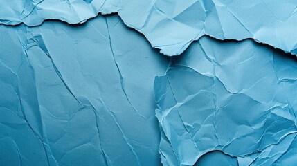Obraz premium Close-up of wrinkled blue paper texture, ideal for scrapbooking and crafting. Top view