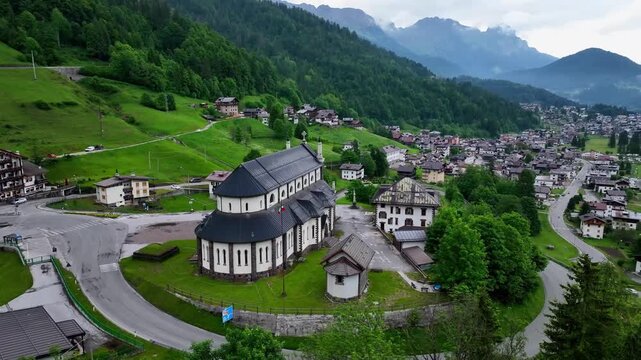 Aerial view above Val di Tires, with the Catinaccio - Torri del Vajolet Rosengarten in the background, South Tyrol, Italy