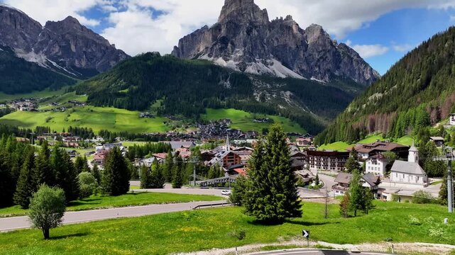 Aerial view above Val di Tires, with the Catinaccio - Torri del Vajolet Rosengarten in the background, South Tyrol, Italy