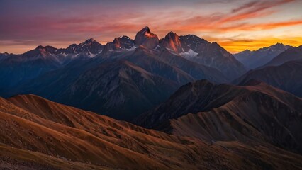 Obraz premium Mountain Sunset: Silhouettes Against a Colorful Sky