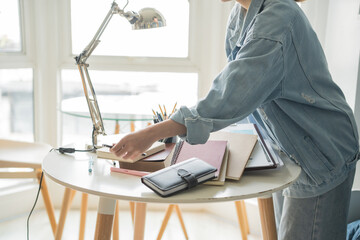 Student asian woman organize room unpack in dorm room college student moving to new  university dormitory or preparing to move out.