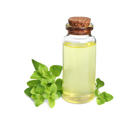 Essential oil in bottle and oregano leaves isolated on white