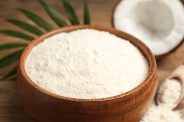 Coconut flour in bowl on table, closeup