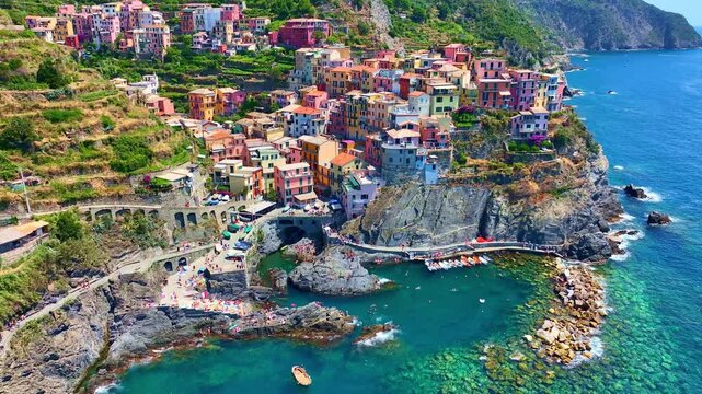Manarola village in Cinque Terre, aerial view, vacation on Italian riviera, drone view of Cinque Terre, Manarola fishing village in Italy, holiday on Ligurian coast