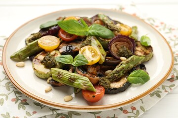 Delicious salad with grilled vegetables on white table, closeup