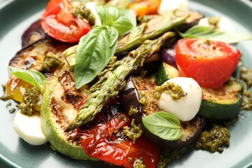 Delicious salad with grilled vegetables on plate, closeup