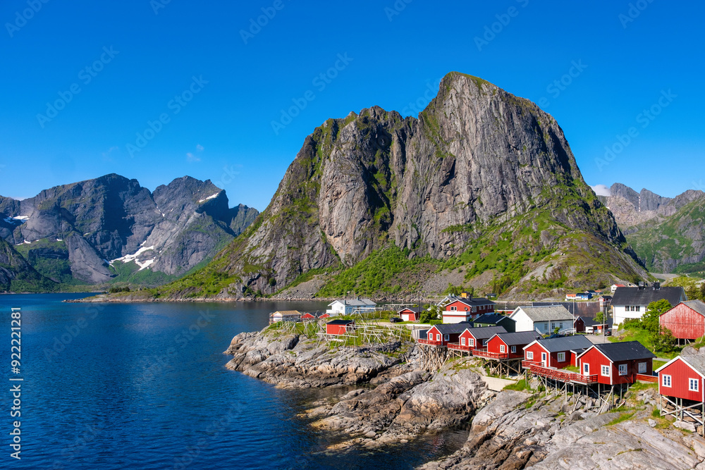 Wall mural stunning fjord landscape lofoten islands in norway, featuring charming red cabins by the water