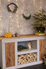 The interior of the Scandinavian-style living room, decorated for the Christmas holidays. Kitchen cupboard in a private house.