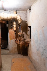 Old insulation of water pipes in the basement of the house