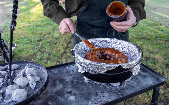 Preparing dessert in cast iron outside