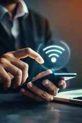 Businessman holding mobile phone with digital wifi icon using modern wifi technology, connected device, internet access