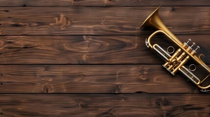 Fototapeta premium A close-up view of a gleaming trumpet resting on a wooden surface beside scattered music sheets, inviting creative expression and harmony