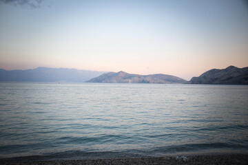 Beautiful rough blue sea with waves and sandy beach. Beautiful day in Greece	
