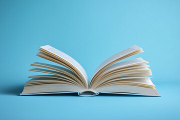 open book on the table blue background