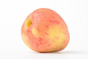 Fresh ripe apple with tiny water drops on white background