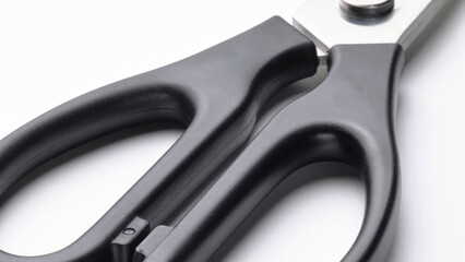 Obraz premium Closeup detail of black kitchen scissors handles.