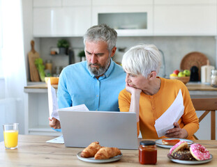 woman man senior bill finance retirement couple home document laptop juice breakfast morning food...