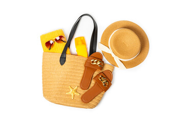 Beach accessories. Beach bag with hat, beach towel, sunglasses, spf cream and sandals isolated on...