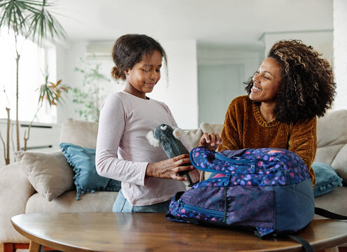 child mother family education school girl home daughter backpack help parent getting ready elementary teen morning hug love helping together black