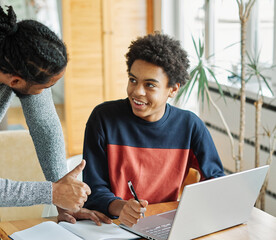 father child home family homework son  teenage parent education laptop teen boy teaching childhood man  learning together school computer internet teacher tutor black