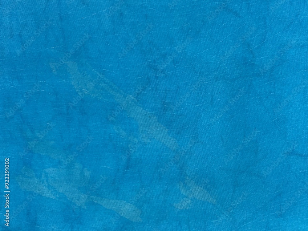 Poster abstract close-up of crumpled aqua blue fabric with subtle shadows and folds creating a textured bac