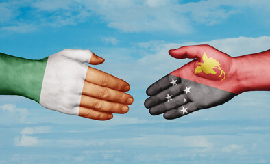 Papua New Guinea and Ireland country handshaking with flags, consensus concept international co-operation illustration