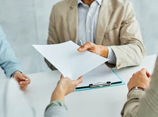 business; meeting; businessman;business meeting businessman office teamwork document contract agreement discussion working talking paperwork colleague man desk deal passing giving pencil pen hand