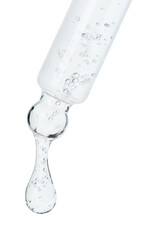 Dripping cosmetic serum from pipette on white background