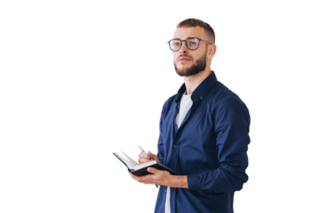 Thoughtful man with glasses writing in a notebook, deep in concentration. Wearing casual attire, he stands isolated on a transparent background