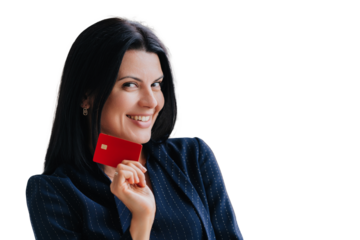 Confident woman with dark hair holding a red credit card, smiling suggestively. Dressed in business attire, isolated on a transparent background
