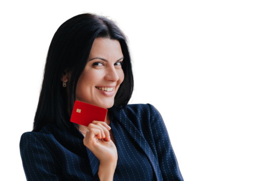 Confident woman with dark hair holding a red credit card, smiling suggestively. Dressed in business attire, isolated on a transparent background