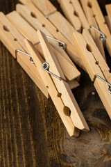 a group of wooden clothespins for drying clothes