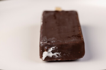 natural eco-friendly ice cream in chocolate glaze lies on a plate