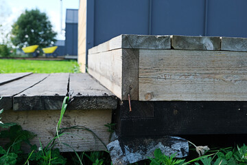 wooden step at barnhouse, close-up, nail sticking out of wood