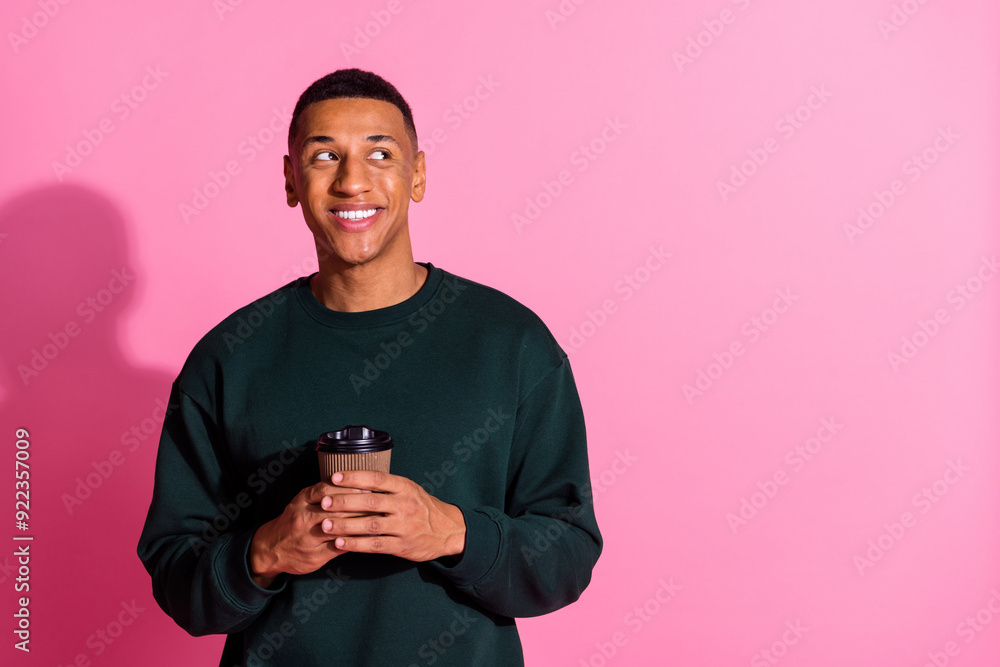 Canvas Prints Photo of attractive funny guy wear sweatshirt drink beverage looking emtpy space isolated pink color background