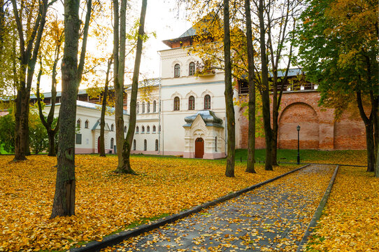 Veliky Novgorod Russia. Chrysostom tower of Veliky Novgorod Kremlin and autumn street with fallen leaves