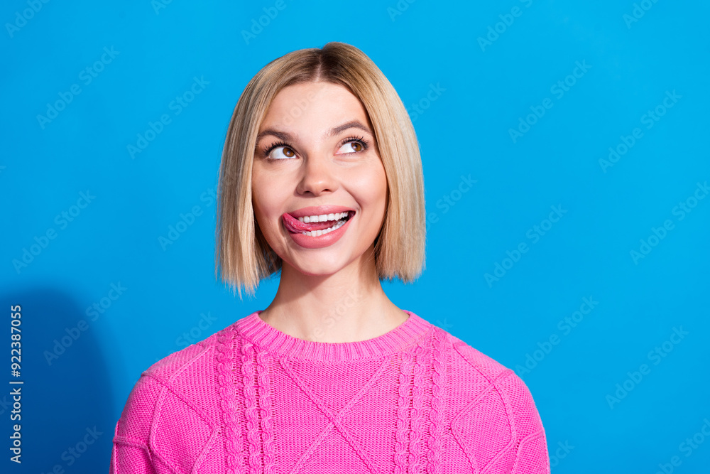 Sticker portrait of pretty young lady lick lips look empty space wear pink sweater isolated on blue color ba