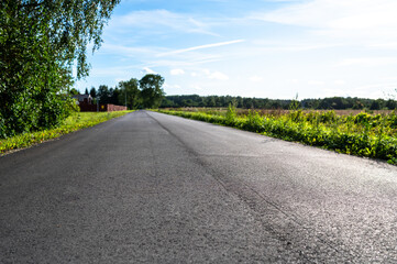 Fototapeta premium A countryside tarmac road in summer