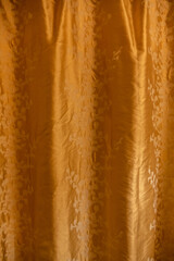 Golden curtain with floral pattern background