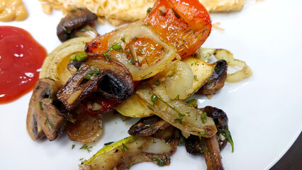 Grilled Vegetables and Mushrooms Served on a White Plate With Ketchup