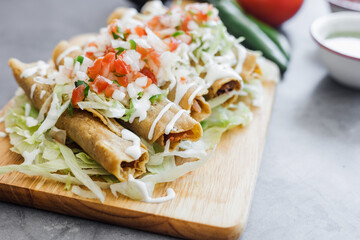 Mexican tacos dorados called flautas with chicken, traditional fried food in Mexico Latin America	
