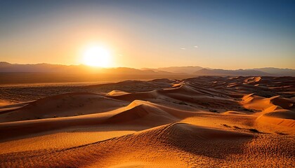 Golden hour paints desert sands and mountain peaks with fiery hues