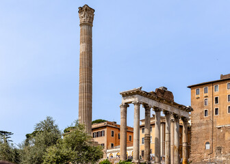 Rome, Italy - April 09, 2024: Ruins of the Roman Forum with tourists strolling among the archaeological remains in Rome, Italy