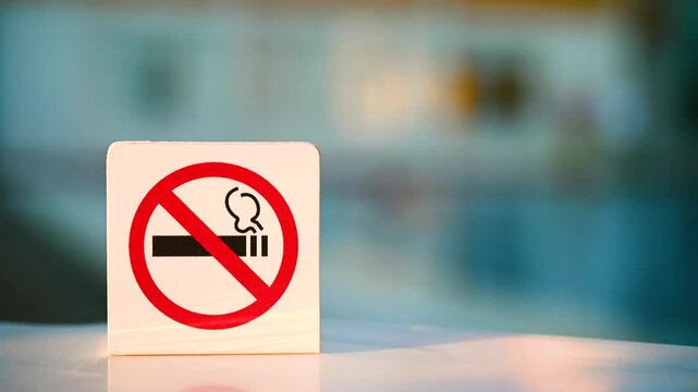 "No smoking" sign. Smoking is prohibited in public places. Prohibitory sign near blue water in the pool. Attention, do not smoke.