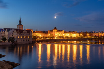 Vltava riverbank seen from the Charles Bridge in the night, Prague, Czech Republic